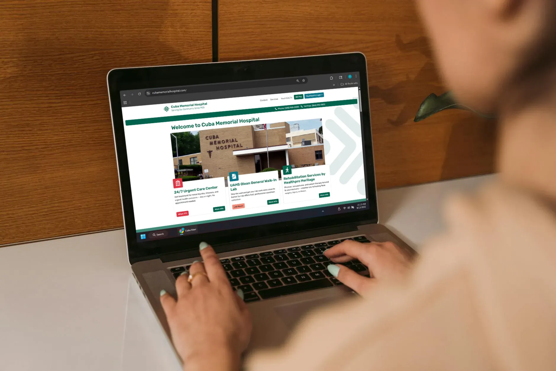 laptop with CMH homepage on the screen
