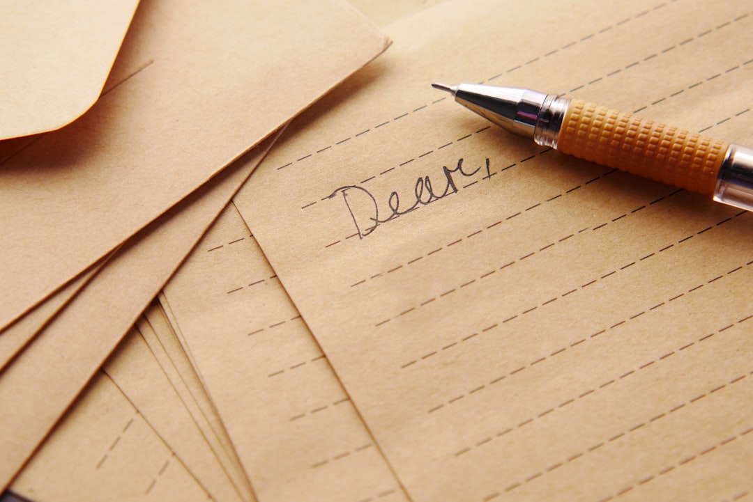 a pen sitting ontop of a piece of paper