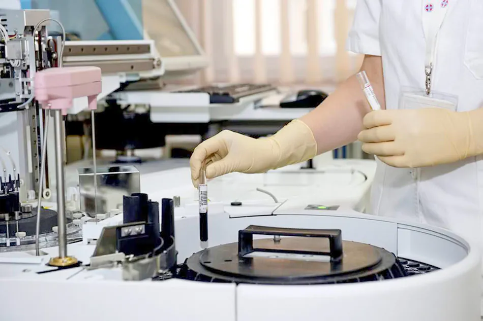Lab technician preparing blood sample for testing